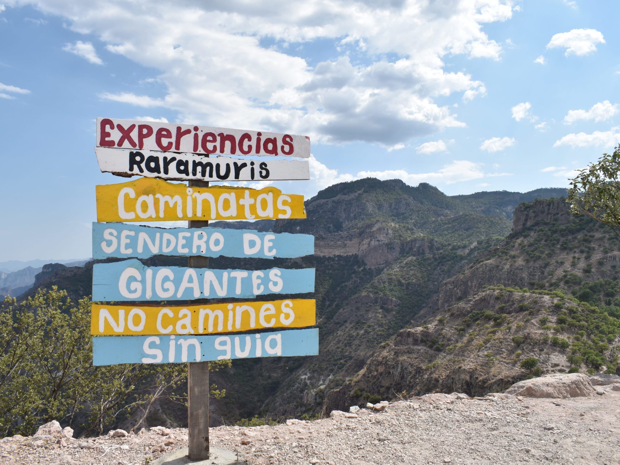 a sign on the side of a mountain