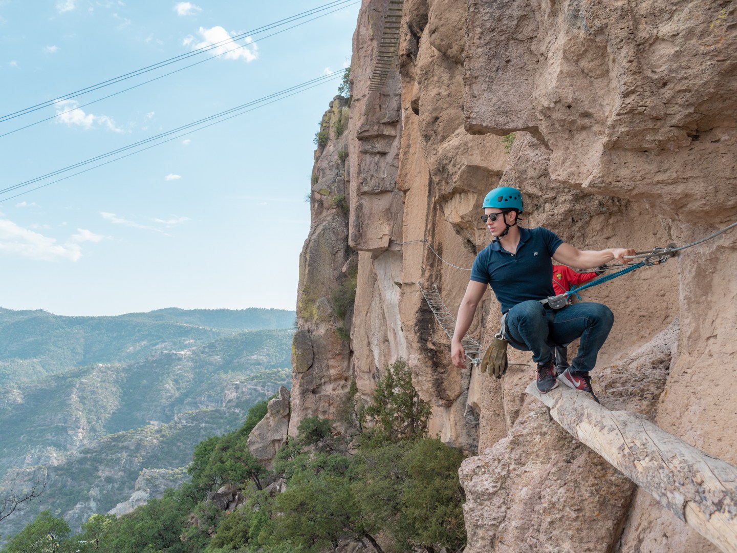 a man riding on top of a rock