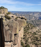 a stone building with a mountain in the background