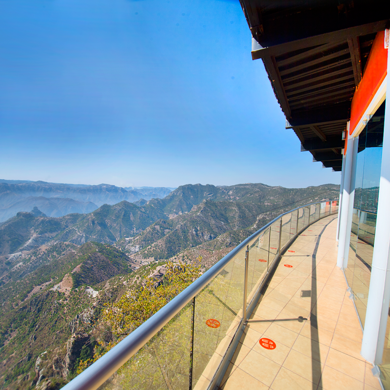 a bridge with a mountain in the background